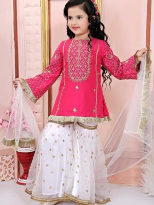 Nikhaar Creations Kids Pink Cotton Silk Kurta Top with Machine Embroidery on front yoke and embroidered sleeves. Worn with Off White Embroidered Net Sharara and Off White Net Dupatta with tassles.