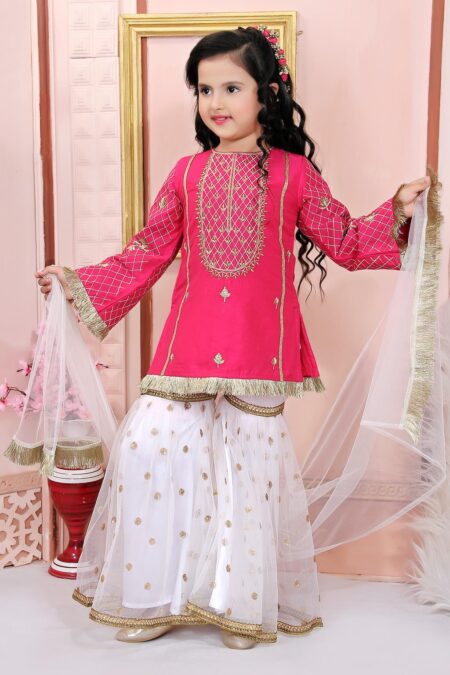 Nikhaar Creations Kids Pink Cotton Silk Kurta Top with Machine Embroidery on front yoke and embroidered sleeves. Worn with Off White Embroidered Net Sharara and Off White Net Dupatta with tassles.