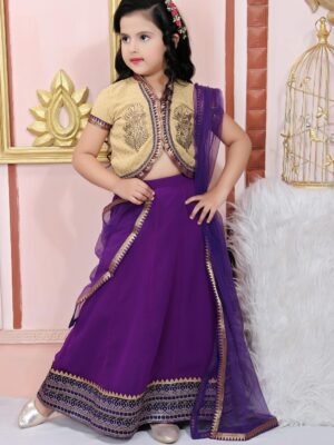 Nikhaar Creations Beige Gold Polka-Dot Georgette Shimmer Choli Worn With Purple Georgette Kalidaar Ghagra Having Thick Pure Banaras Brocade Border together With Gota Detailing In The Hemline. Purple Brocade Border Detailing On The Choli And Sleeve With Antique Gold Motifs On The Choli.