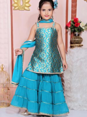 Nikhaar Creations Kids Turquoise Blue Jacquard Short Kurta with Lace Detailing on the straps and hemline. Worn with four tiered sharara with lace detailing on each tier.